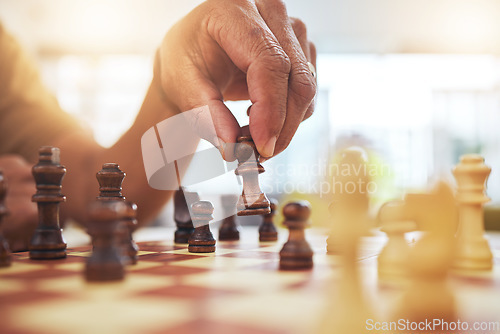 Image of Person, chess and hands with pawn on board game for strategy, challenge and learning tabletop brain games. Closeup, chessboard and player moving pieces for winning contest, competition and fun hobby