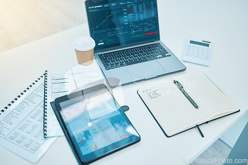 Image of Technology, office desk and trading, stock market and paperwork, finance and statistics information. Calculator, notebook with tablet and laptop, screen and data analytics with documents and fintech