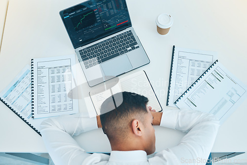 Image of Business man, sleep on desk with trader, laptop and stock market, paperwork with statistics information and fatigue. Insomnia, overworked and burnout, data analysis and top with finance and analytics
