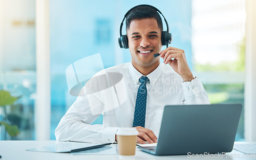 Image of Call center, laptop and portrait of man in customer service, support or help desk office. Face, telemarketing and happy sales agent in communication, consultant and professional to contact us for crm