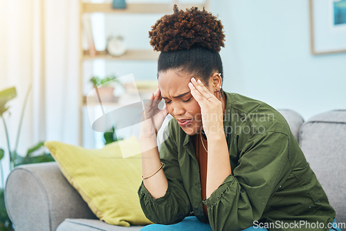 Image of Woman, headache and pain on sofa for stress, dizzy and challenge of mental health at home. Sad african person frustrated for migraine, anxiety or depression of fatigue, debt or vertigo in living room