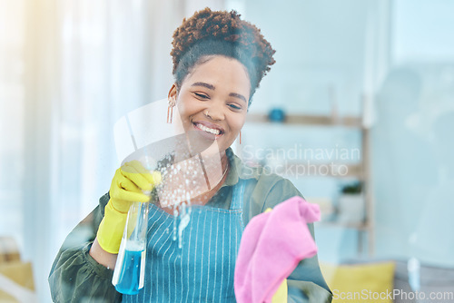 Image of African woman, cleaning window with chemical spray and cloth, smile for hygiene and housekeeping or hospitality. Cleaner, liquid detergent and disinfectant, service or maintenance with labor and foam