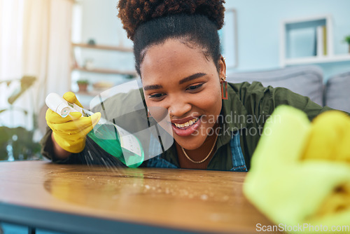 Image of Smile, woman and cleaning table with gloves, spray bottle and soap detergent, housekeeping in home or hotel. Housework, smudge and housekeeper or cleaner service washing dirt off counter in apartment