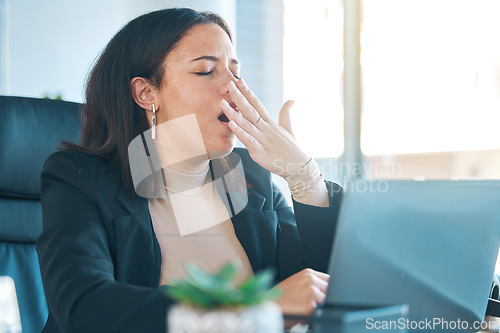 Image of Business woman, laptop and tired with yawn while working, burnout and deadline, lawyer with case research and overtime. Fatigue, overworked and wellness, insomnia and attorney with brain fog