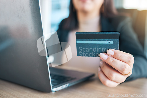 Image of Business woman, hands and credit card on laptop for e commerce, online shopping and fintech payment in office. Professional worker on computer for website, banking security and investment or loan