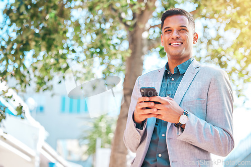 Image of Cellphone, city and happy business man scroll, walking and smile for company social media, website search and contact user. Smartphone communication, sidewalk or relax person on urban commute journey