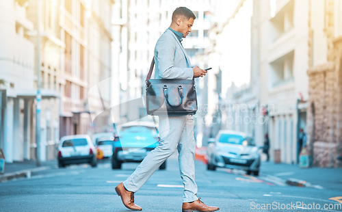 Image of Phone, city sidewalk and business man walking, typing and texting professional legal contact, lawyer or advocate. Cellphone communication, crossing road or corporate attorney on urban commute journey