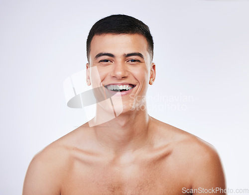 Image of Man, beauty and face, skin and happy with grooming for hygiene and clean isolated on white background. Portrait, model and dermatology, skincare and treatment with cosmetics and wellness in a studio