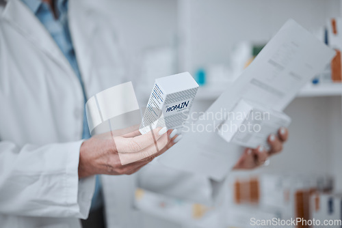 Image of Person, pharmacist and hands with box of medication, pharmaceutical or pills on shelf at drugstore. Closeup of medical or healthcare employee with drugs, prescription meds or inspection at pharmacy