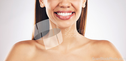 Image of Woman, face and teeth with smile, dental and health, skin and lip gloss isolated on white background. Mouth wellness, oral healthcare and orthodontics, veneers and makeup, cosmetic care in studio