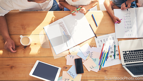 Image of Family hands, children and writing, e learning or home education support, helping and math in school books by table above. People teaching kids, online development and numbers with laptop technology