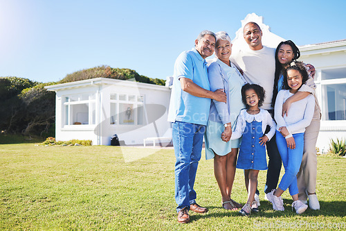 Image of Happy family, portrait and real estate on garden grass in property, investment or moving in new home together. Parents, grandparents and kids smile in happiness for buying house, building and finance