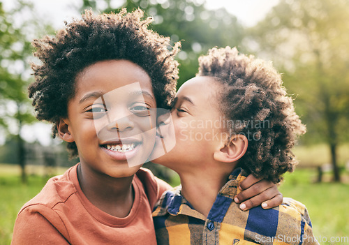 Image of Portrait, kids and boy siblings kiss in a park for play, fun and bonding in nature together. Family, face and brothers hug, African children and happy outdoor with love, support and trust on weekend