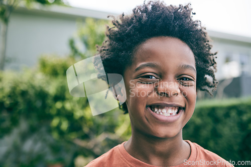 Image of Happy portrait, child and boy outdoor in garden, park and backyard of home for fun, good mood and play. Face, smile and confident young african kid relaxing in summer, nature and freedom in Nigeria