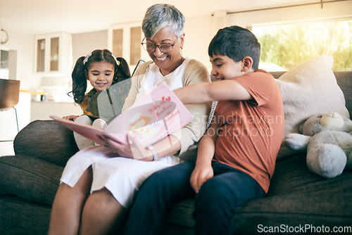 Image of Happy kids, smile or grandmother reading a book for learning, education or storytelling on sofa at home. Family, senior or grandma with children siblings for a fantasy story to enjoy bonding together