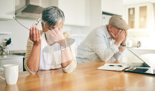 Image of Frustrated senior couple, headache and fight in divorce, debt or financial crisis together at home. Unhappy mature man and woman in stress, anxiety or depression in finance struggle, fail or mistake