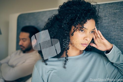 Image of Couple, fight and stress in bedroom for divorce, anger and thinking of breakup, cheating and anxiety. Face of frustrated, sad and depressed woman with partner in bed for conflict, argument and drama
