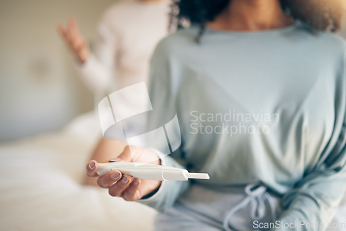 Image of Hands, woman and bed with pregnancy test, closeup and home for results, planning or news to start family. Girl, exam and notification in bedroom, apartment and anxiety for maternity, future or baby