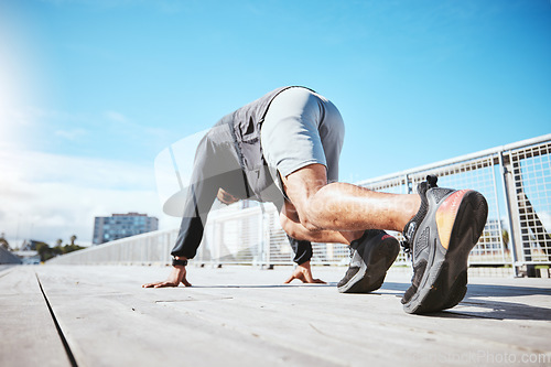 Image of Exercise, running and a the back of a man at the start of his workout in the city for cardio or endurance training. Fitness, bridge and shoes of a male runner or athlete outdoor for a challenge