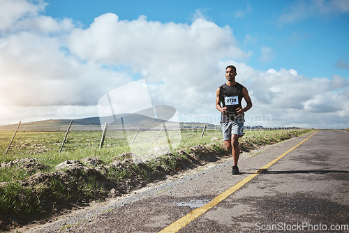 Image of Exercise, marathon runner and man on road outdoor, cardio or healthy body. Athlete, training and fitness in race competition, workout energy or sport on street in wellness at countryside mockup space