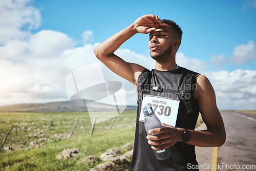 Image of Fatigue, marathon runner and man with water outdoor on road, fitness and healthy body. Tired, bottle and exhausted athlete sweat in training, exercise and workout in race competition at countryside