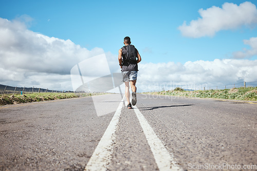Image of Back, marathon runner and man on road outdoor, cardio and healthy body. Athlete, training and fitness exercise in competition, workout sport or race on street in wellness at countryside mockup space