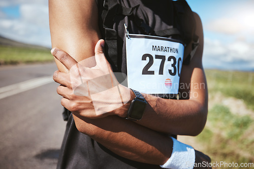 Image of Arm injury, marathon runner and person massage bruise problem, muscle ache or sore anatomy risk from exercise challenge. Joint pain, closeup and athlete hurt from running accident, training or cardio