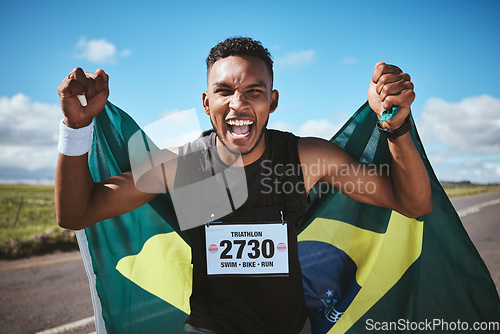 Image of Portrait, sports and flag of Brazil with a man runner on a street in nature for motivation or success. Fitness, winner and celebration with an athlete cheering during a cardio or endurance workout