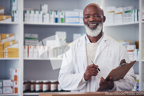 Image of Pharmacy portrait, clipboard and mature black man writing notes of hospital product, healthcare drugs or clinic stock. List, pills or happy African pharmacist smile for store pharmaceutical inventory