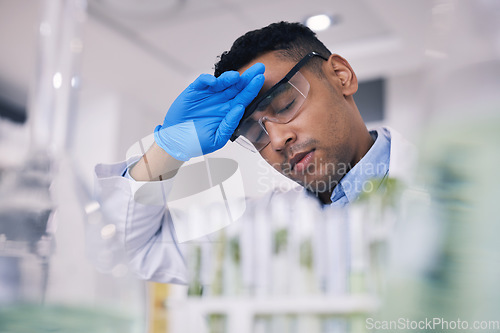 Image of Tired, science and a man with burnout in a laboratory for research or innovation in medicine. Fatigue, fail and a young male scientist working to a deadline in a lab for medical breakthrough