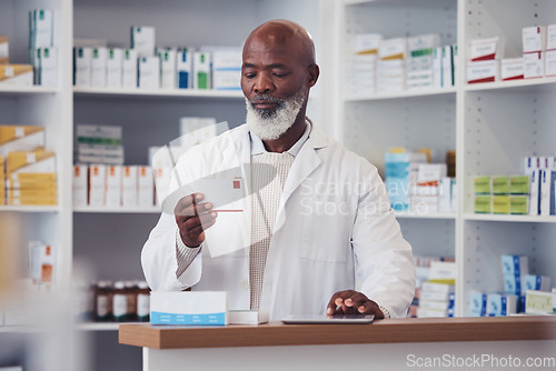 Image of Black man, pharmacist and pill box with a tablet, medication boxes and healthcare with inventory. Person, pharmacy and professional with information, drugstore and medicine with tech and prescription