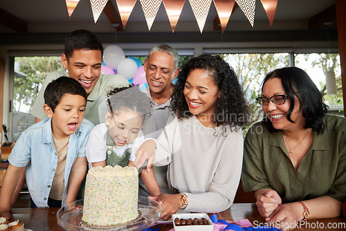 Image of Family, birthday cake and excited at party to celebrate and cut slice together for dessert. Fun, happy and event for parents and grandparents with young children at a table for holiday celebration