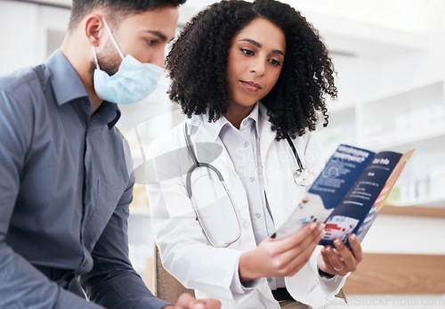 Image of Doctor, clinic patient and healthcare brochure for virus, disease and pharmacy information, advice or support. Pharmacist woman and sick man in face mask for covid tips, compliance or safety document