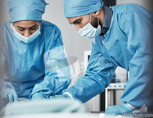 Image of Doctors, surgery and hospital team in emergency, safety and helping patient. Man, woman and healthcare collaboration of medical surgeon, nurse and operation theater for support in ppe, mask or clinic