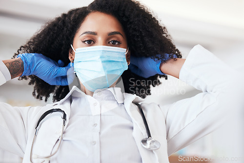 Image of Doctor, woman and face mask for virus, bacteria and protection in medical exam, clinic or hospital. Healthcare worker, surgeon or nurse in portrait for covid 19 health, safety and medical compliance