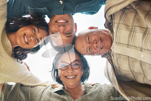 Image of Portrait, smile and family in a huddle with senior parents from below during a summer day closeup. Love, support and elderly people with a son or daughter in law in a circle together for bonding