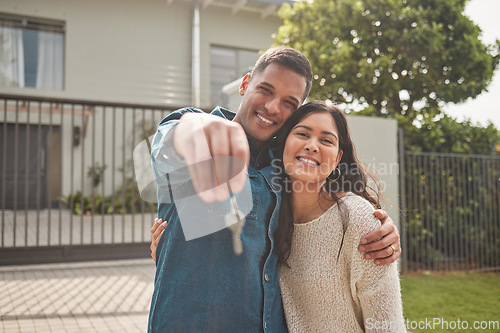 Image of Happy couple, portrait and real estate with keys in property, investment or new home together. Man and woman or homeowners smile for moving in, buying or building loan in asset finance or investing