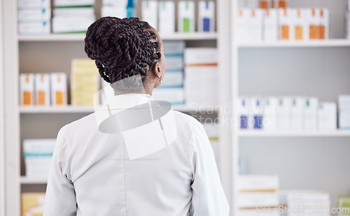 Image of Pharmacy, search and back of woman in store for medicine, inventory and medical. Healthcare, retail and wellness with person and shopping shelf for supplements, pills dispensary and prescription