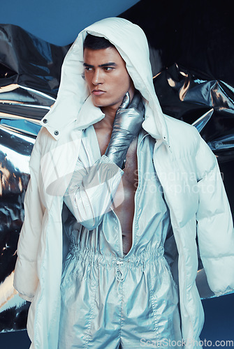 Image of Futuristic, fashion and man with jumpsuit and vaporwave ski style with sci fi and gen z clothing in studio. Art, creative and young male model with trendy, cool designer clothes and cyberpunk jacket