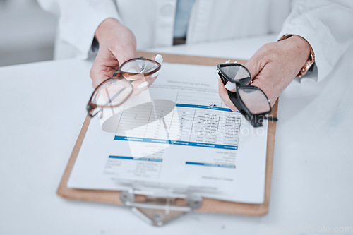 Image of Clipboard, optometry and glasses for vision and eye care or wellness in an optical clinic. Checklist, medical and closeup of prescription spectacles with lens for optometrist or oculist treatment.