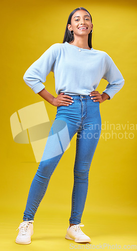 Image of Happy, fashion and student with portrait of woman in studio for future, pride and smile. Youth, confident and college with Indian person on yellow background for funny, learning and trendy style