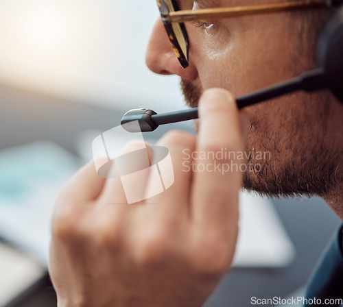 Image of Businessman, call center and closeup of headphones in customer service, support or telemarketing at office. Man, consultant or agent talking on mic in online advice, help or contact us at workplace