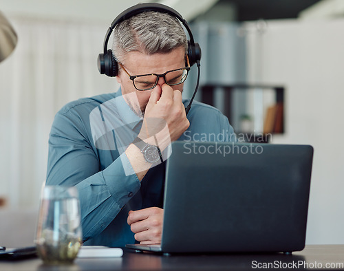 Image of Senior businessman, call center and headache in burnout, mistake or stress in customer service at office. Frustrated mature man, consultant or agent in depression, overworked or migraine at workplace