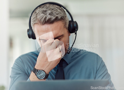 Image of Senior businessman, call center and headache in stress, burnout or mistake in customer service at office. Frustrated mature man, consultant or agent in depression, overworked or migraine at workplace