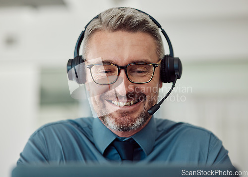 Image of Senior, happy man and call center with headphones in telemarketing, customer service or support at office. Mature businessman, consultant or agent smile in online advice or contact us at workplace