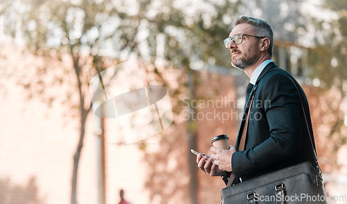 Image of Mature business man, city and building, glasses and cellphone with coffee and bag in street on bokeh background. Entrepreneur, professional person and manager standing and wait for traffic outside