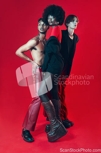 Image of Fashion, group and portrait with diversity of gay people with creative black woman, man and model on red background. Lgbt, friends and beauty for edgy, gen z or unique aesthetic makeup in studio