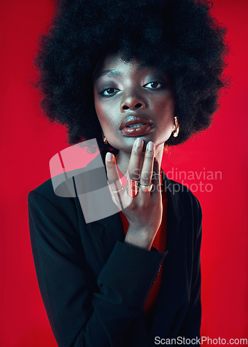 Image of Black woman, portrait and afro, hair and beauty with makeup and shine isolated on red background. Hairstyle, haircare and texture with growth, face skin glow and confident African model in a studio