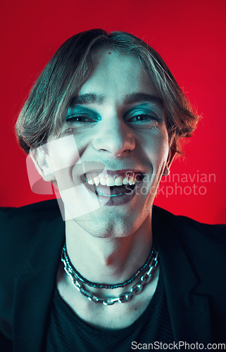 Image of Fashion, face and funny gay man in makeup at studio isolated on a red background. Cosmetics, lgbtq style and portrait of model laughing in cool clothes, aesthetic and happy queer person in Australia