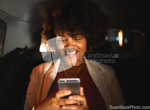 Image of Black woman, afro and phone at night in taxi, travel or communication in social media or networking. Happy African female person smile in online chatting or late evening on mobile smartphone in car